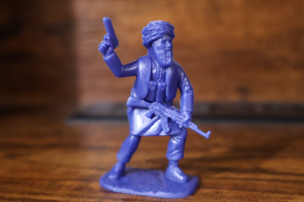taliban toy soldier holding pistol