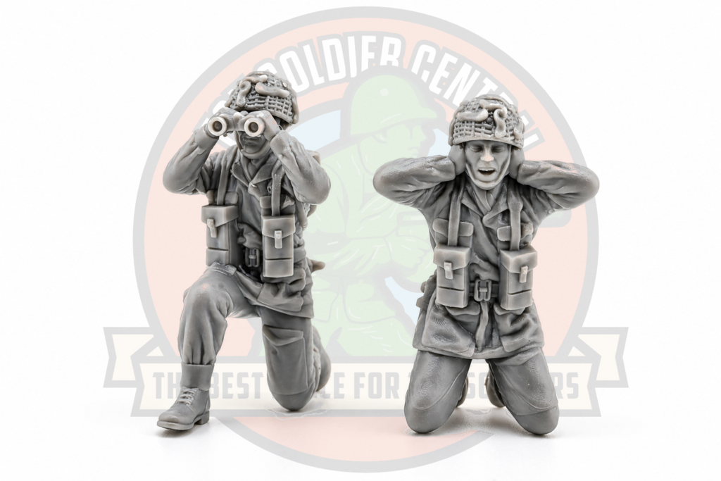 Two grey british soldiers crouched 6 pound crew